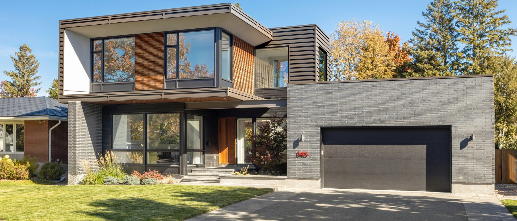 A contemporary two-storey house with brick and timber cladding